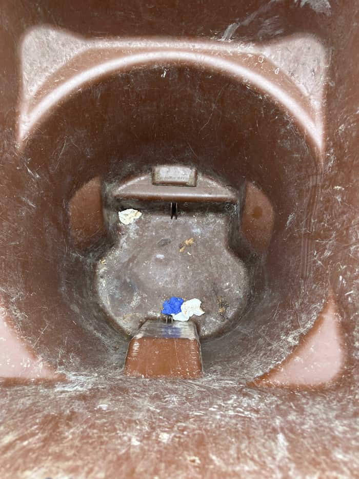 Dirty stained trash bin before professional cleaning