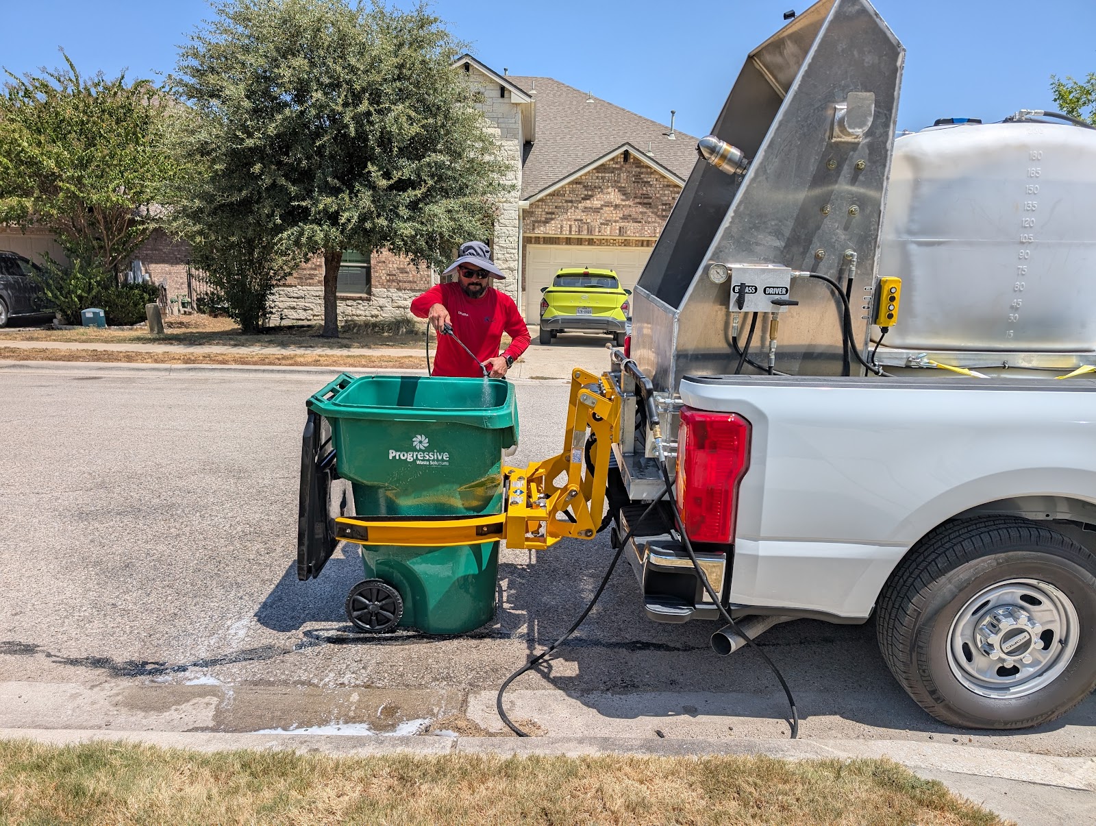 Keep Bin Clean truck and technician cleaning a cart for A. Sian